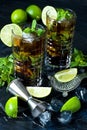 Cocktail Cuba libre in glass on dark background Royalty Free Stock Photo