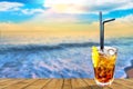 Cuba libre exotic tasty cocktail with beautiful sunset background