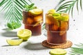 Cuba Libre, long island cocktail with rum, cola, mint and lime in the glass, recipe background. Close up Royalty Free Stock Photo