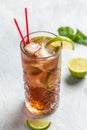 Cuba Libre or long island iced tea cocktail with strong drinks, cola, lime and ice in glass, Alcoholic or non-alcoholic cold Royalty Free Stock Photo