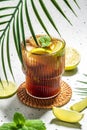 Cuba Libre with rum, cola, mint and lime in the glass on a light background, vertical image. top view. place for text Royalty Free Stock Photo