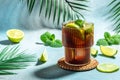 Cuba Libre with rum, cola, mint and lime in the glass on table at tropical resort, place for text, top view Royalty Free Stock Photo