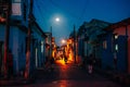 CUBA - MARCH 2019 Street view at night with people drive out of their home. Royalty Free Stock Photo