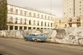 CUBA OLD HAVANA STREET SCENE WITH GRAFFITI ON wall and classic car WALL
