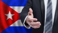 Cuba politics, cooperation and travel concept. Hand on Cuban flag background Royalty Free Stock Photo