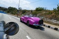 Cuba two old pink car on the road