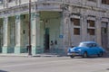 Cuban car waiting at street corner