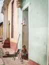 Cuban child standing in doorway