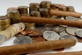 Cuban cigars with coins isolated on white Royalty Free Stock Photo