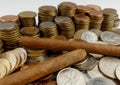 Cuban cigars with coins isolated on white Royalty Free Stock Photo