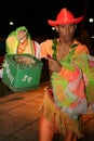 Cuban dancer collect money after show