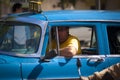 Cuban drives a classic American car as a taxi in Old Havana