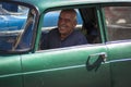 Cuban drives a classic American car as a taxi in Old Havana