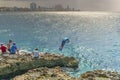 A Cuban family enjoys their free time on the coastline along Havana`s famous Malecon in May 2017