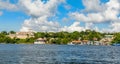 Cuban fishing boats and village houses with Jagua Spanish castle walls in the background, Cienfuegos province, Cuba