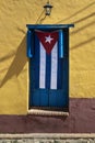 Cuban flag hanging on a door in Trinidad, Cuba Royalty Free Stock Photo