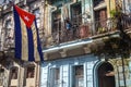 A Cuban flag hangs proudly from a balcony in the streets of Central Havana Royalty Free Stock Photo