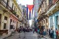 A Cuban flag hangs proudly from a balcony in the streets of Central Havana Royalty Free Stock Photo