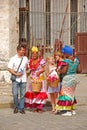 Cuban hospitality with local Cubans in their traditional attire trying to invite visitors to a local event