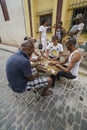 Cuban men playing game of dominoes that is very popular in Cuba