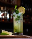 Cuban mojito drink with lemon mint and good herb on a wooden base with a bar background