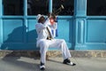 Cuban musician playing the trumpet next to a cuban flag at a street in Old Havana, Cuba Royalty Free Stock Photo