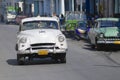 Cuban person drives vintage American car at the street of Pinar del Rio, Cuba.