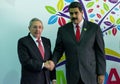 Cuban President Raul Castro greets Venezuelan President Nicolas Maduro