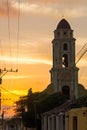 Cuban street sunset with oldtimer in Trinidad, Cuba Royalty Free Stock Photo