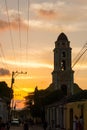 Cuban street sunset with oldtimer in Trinidad, Cuba Royalty Free Stock Photo