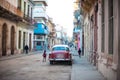 Cuban street view with Red Car