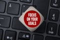 Cube on laptop keyboard with message focus on your goals Royalty Free Stock Photo