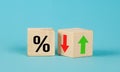 Cube block with percentage symbol icon. Interest rate financial and mortgage rates concept. Wood cube change arrow down