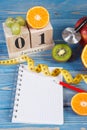 Cube calendar, fruits, dumbbells and tape measure, new years resolutions