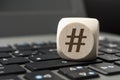 Cube Dice with Hashtag symbol on a keyboard