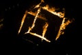 A cube of fire at night