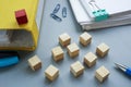 Cube on a folder as a leader, symbolizing bureaucratic leadership and organizational hierarchy. Royalty Free Stock Photo