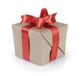 Cube gift box wrapped with kraft paper and red bow Royalty Free Stock Photo