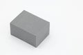 Cube of grey foam plastic.