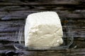 A cube of low salt white cheese, a savory twist to a variety of recipes, used for preparing salads, pizza, sandwiches, pasta and