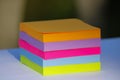 A cube of piled sticky notes of several pastel and bright colors Royalty Free Stock Photo