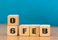 Cube shape calendar for February 06 on wooden surface with empty space for text,cube calendar for december on wood background Royalty Free Stock Photo