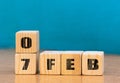 Cube shape calendar for February 07 on wooden surface with empty space for text,cube calendar for december on wood background Royalty Free Stock Photo