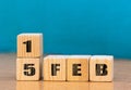 Cube shape calendar for February 15 on wooden surface with empty space for text,cube calendar for december on wood background Royalty Free Stock Photo