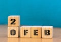 Cube shape calendar for February 20 on wooden surface with empty space for text,cube calendar for december on wood background Royalty Free Stock Photo