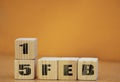 Cube shape calendar for february 15 on wooden surface with empty space for text, new year Wooden calendar with date, February cube Royalty Free Stock Photo