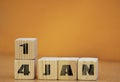 Cube shape calendar for January 14 on wooden surface with empty space for text, new year Wooden calendar with date, January cube