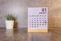 Cube shape calendar for January 20 on wooden surface with empty space for text,cube calendar for January.