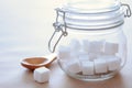 Cube Sugar in Glass Jar with Sunlight â Warm and Minimal Concept Royalty Free Stock Photo