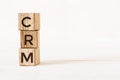 Cube wooden block with alphabet combine the word abbreviation CRM on white background Royalty Free Stock Photo